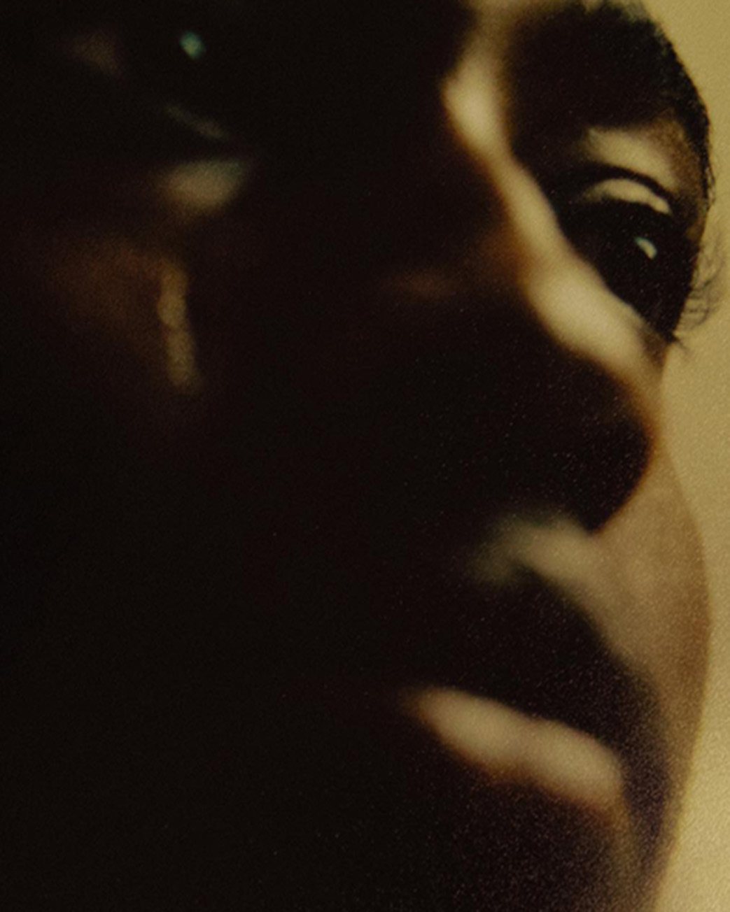 moody close-up of natural skin in soft artistic lighting